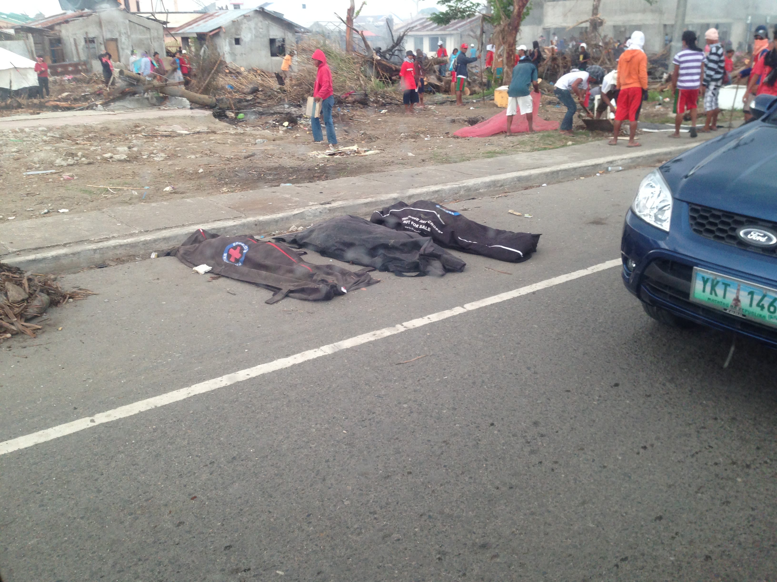 Cadaver bags on the streets of Tacloban City, waiting for collection. Image taken a week after Yolanda's landfall. By Makoi Popioco